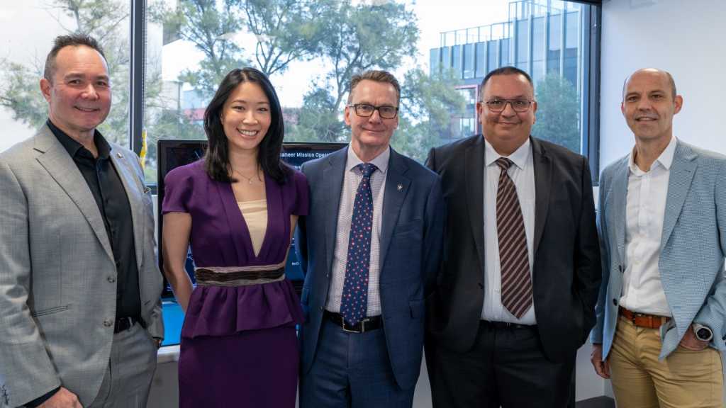 A photograph of, from left to right, iLAuNCH TrailBlazer's Darin Lovett, HEO's Joann Yap, Optus' Nick Leake, Defence Science and Technology Group's Suneel S. Randhawa and Inovor Technologies' Matthew Tetlow.