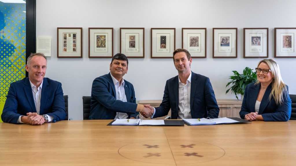 A photograph of, from left to right, SAP's Peter Moore, Infosys' Raja Shah and Melbourne Archdiocese Catholic Schools' Edward Simons and Vicki Russell.