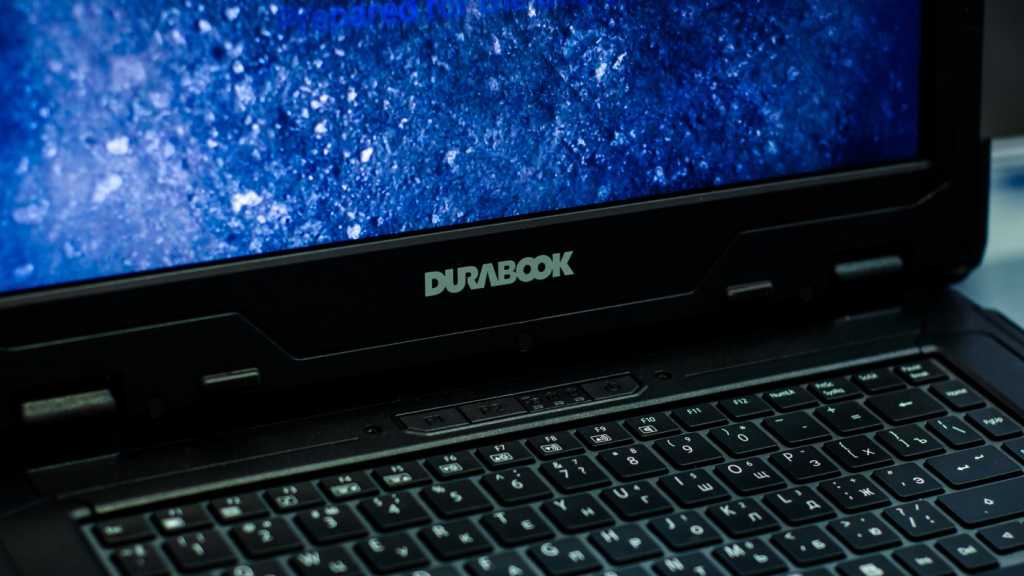 A photograph of a Durabook laptop, with the camera focused on the Durabook logo below the screen.